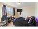 Cozy bedroom with a large window, and modern decor at 3716 W Colton Ave, North Las Vegas, NV 89032