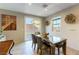 Inviting dining area with sliding glass doors and backyard access and modern chandelier at 3716 W Colton Ave, North Las Vegas, NV 89032