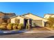 Charming single-story home with a neutral exterior, brick driveway, and well-maintained landscaping at 3716 W Colton Ave, North Las Vegas, NV 89032