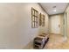 Welcoming hallway with tiled floors, stylish wall decor, and a convenient entryway bench at 3716 W Colton Ave, North Las Vegas, NV 89032