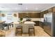 Well-equipped kitchen features stainless steel appliances, a large island, and sleek countertops at 3716 W Colton Ave, North Las Vegas, NV 89032