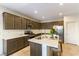 Lovely kitchen featuring stainless steel appliances and a large kitchen island with bar seating at 3716 W Colton Ave, North Las Vegas, NV 89032