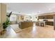 Spacious open-concept living area featuring tile floors, modern furnishings, and a gourmet kitchen at 3716 W Colton Ave, North Las Vegas, NV 89032