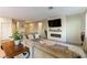 Comfortable living room with tile flooring, cozy sofas, fireplace, and stylish decor at 3716 W Colton Ave, North Las Vegas, NV 89032