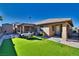 Backyard with covered patio, artificial turf, and outdoor furniture at 5021 Ray Frank Blvd, Pahrump, NV 89060