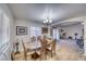 Spacious dining room with hardwood floors and a lovely chandelier at 5021 Ray Frank Blvd, Pahrump, NV 89060