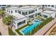Aerial view showcasing a modern home's backyard oasis with a pool, spa, and stylish patio furniture at 9760 Solar Ave, Las Vegas, NV 89149