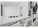 Modern bar area with sleek countertops, seating, and elegant backsplash design at 9760 Solar Ave, Las Vegas, NV 89149