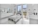 Modern bathroom featuring a soaking tub with marble surround and dual vanities at 9760 Solar Ave, Las Vegas, NV 89149