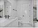 Modern bathroom showcasing a pristine vanity, toilet, and sleek fixtures against a decorative accent wall at 9760 Solar Ave, Las Vegas, NV 89149