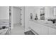 Contemporary bathroom featuring double sinks, stylish mirrors, and luxurious finishes throughout at 9760 Solar Ave, Las Vegas, NV 89149