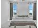 Light-filled bedroom features scenic views from its large windows and plush, neutral carpeting at 9760 Solar Ave, Las Vegas, NV 89149