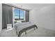 Inviting bedroom with scenic views from its large windows and plush, neutral carpeting at 9760 Solar Ave, Las Vegas, NV 89149