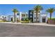Contemporary home featuring modern design, palm trees, and xeriscaping, providing curb appeal at 9760 Solar Ave, Las Vegas, NV 89149