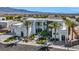 Modern home showcases clean lines, complemented by palm trees and manicured landscaping during daylight at 9760 Solar Ave, Las Vegas, NV 89149