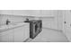 Sleek laundry room with modern washer, dryer, cabinets, and sink at 9760 Solar Ave, Las Vegas, NV 89149