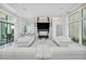 Stylish living area with marble fireplace, recessed lighting, and access to the outdoor patio at 9760 Solar Ave, Las Vegas, NV 89149