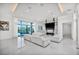 Spacious living area with modern decor, plush seating, and seamless indoor-outdoor flow to the patio at 9760 Solar Ave, Las Vegas, NV 89149