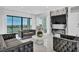 Sophisticated living area featuring stylish seating, a modern fireplace, and large windows showcasing natural light and views at 9760 Solar Ave, Las Vegas, NV 89149