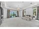 Expansive primary bedroom featuring a chandelier, recessed lighting, and views of the outdoor pool at 9760 Solar Ave, Las Vegas, NV 89149
