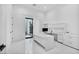 Bright office space with modern white desk, cabinetry, and large sliding glass doors for natural light and an airy feel at 9760 Solar Ave, Las Vegas, NV 89149