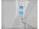 Bright white staircase with modern design features and large windows at 9760 Solar Ave, Las Vegas, NV 89149