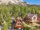 A-frame cabin showcasing a wrap-around deck and beautiful views at 2196 Via Dulcedo St, Mount Charleston, NV 89124