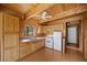 A well-lit kitchen with wooden cabinets, providing ample storage and counter space at 2196 Via Dulcedo St, Mount Charleston, NV 89124