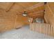 Open loft space with wood paneling, carpet, and natural light at 2196 Via Dulcedo St, Mount Charleston, NV 89124