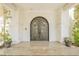 Detailed wrought iron front door with covered entry, offering a grand welcome at 2349 Villandry Ct, Henderson, NV 89074