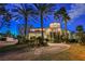 Stately home with a circular driveway, mature landscaping, and an elegant facade at 2349 Villandry Ct, Henderson, NV 89074