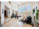 Grand living room featuring soaring ceilings, abundant natural light, and a pool table at 2349 Villandry Ct, Henderson, NV 89074