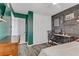 Stylish bedroom with a built-in desk and sleek flooring at 4474 Dawley Ct, Las Vegas, NV 89104