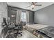 Modern bedroom featuring wood floors, dark walls, and a dedicated workspace at 4474 Dawley Ct, Las Vegas, NV 89104