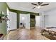 Spacious bedroom with tile floors, double doors, and a glimpse of the laundry room at 4474 Dawley Ct, Las Vegas, NV 89104