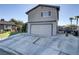 A charming two-story home with a well-maintained lawn, spacious driveway, and attached two-car garage at 4474 Dawley Ct, Las Vegas, NV 89104