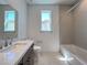 Bathroom featuring a vanity, toilet, and a shower/tub at 9009 Shifting Skye St, Las Vegas, NV 89166