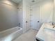 Bathroom featuring dual sinks and a shower/tub at 9009 Shifting Skye St, Las Vegas, NV 89166