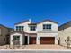 Charming two-story home with a red tile roof and a two-car garage at 9009 Shifting Skye St, Las Vegas, NV 89166