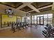 Bright gym with stationary bikes, large mirrors, and multiple TVs for entertainment during workouts at 9009 Shifting Skye St, Las Vegas, NV 89166
