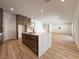 Modern kitchen with a central island and open layout to the living area at 9009 Shifting Skye St, Las Vegas, NV 89166