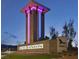 Community sign featuring the Skye Canyon name and a tower lit with vibrant colors at 9009 Shifting Skye St, Las Vegas, NV 89166