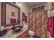 Bathroom with a copper sink, granite countertop, and patterned shower curtain at 8429 Brackenfield Ave, Las Vegas, NV 89178