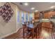 Kitchen dining area with hardwood floors and a large table at 8429 Brackenfield Ave, Las Vegas, NV 89178