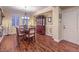 Formal dining room with hardwood floors, chandelier, and decorative accents at 8429 Brackenfield Ave, Las Vegas, NV 89178