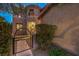 Elegant entryway with a stone facade and wrought iron gate at 8429 Brackenfield Ave, Las Vegas, NV 89178