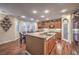 Modern kitchen with granite counters, stainless steel appliances, and an island at 8429 Brackenfield Ave, Las Vegas, NV 89178