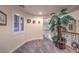 Charming plant nook with a large potted palm tree and carpet at 8429 Brackenfield Ave, Las Vegas, NV 89178