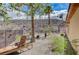 Landscaped backyard with lounge chair and mountain views at 1150 Calcione Dr, Henderson, NV 89011