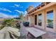 Spacious patio with seating area, access to house and mountain views at 1150 Calcione Dr, Henderson, NV 89011